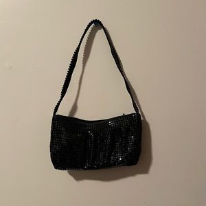 A black mini sequined purse